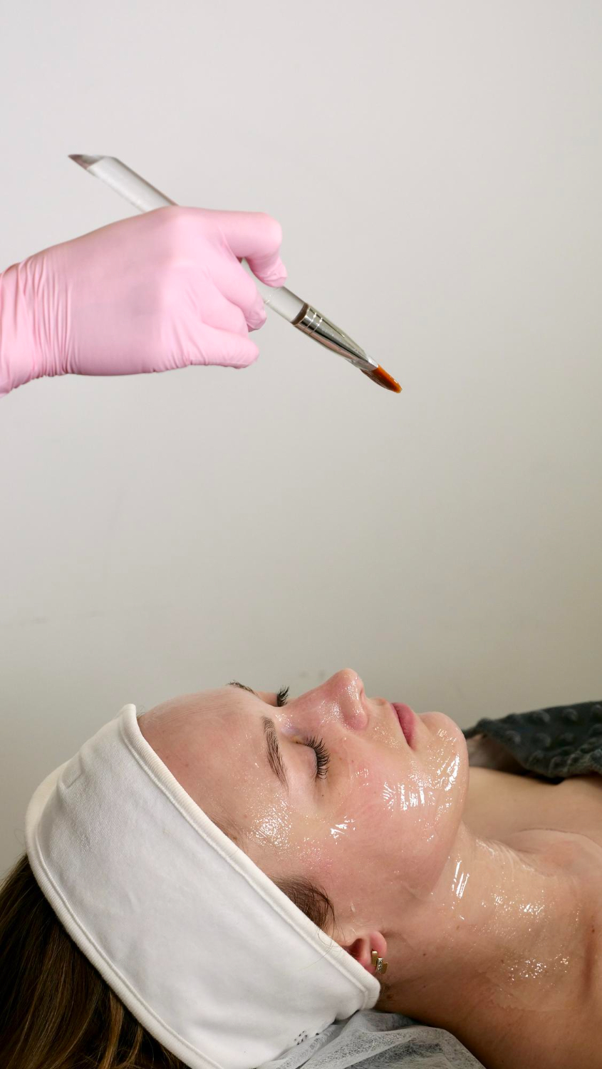 Patient enjoying a luxury facial treatment representing chemical peel skin renewal